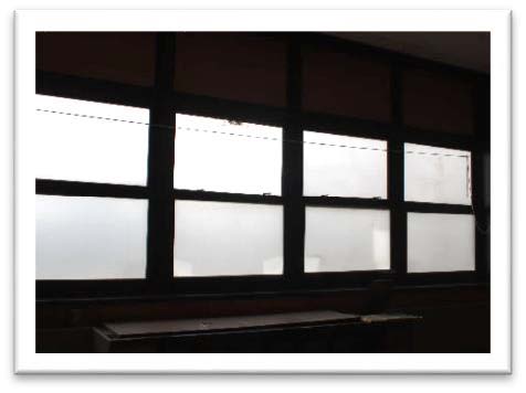 Original windows that were opaque and therefore did not provide appropriate daylight